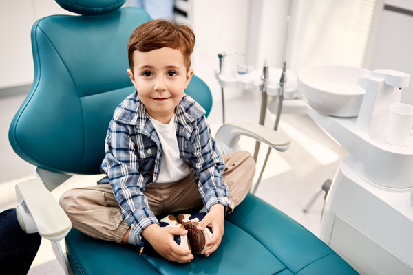Should I Take My Child To A Kid Friendly Dentist In Milwaukie For White Spots On Teeth?